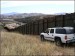 US Border Patrol officer the fence at the US-Mexico boredr.jpg